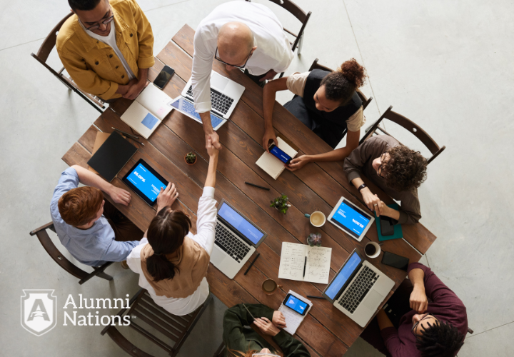 Team collaborating around a table during a strategy meeting.