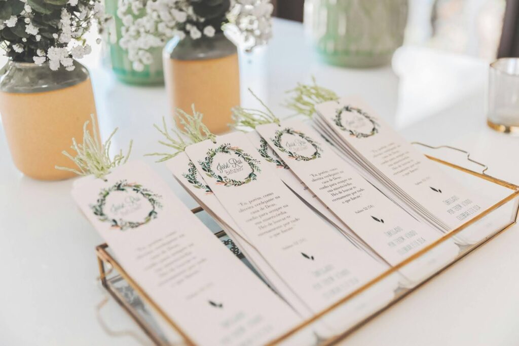 Invitations and Handouts placed on a table.
