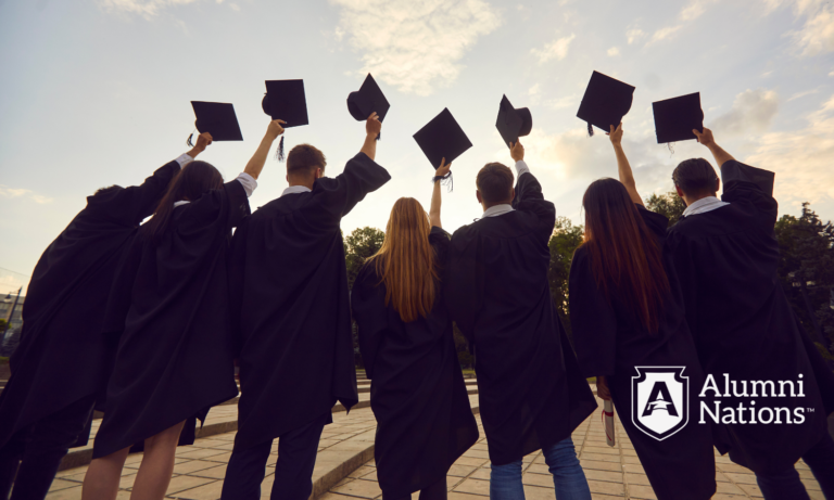 Group of graduates in caps and gowns raising their hands in celebration, symbolizing alumni pride and unity; Alumni Nations logo in the corner.