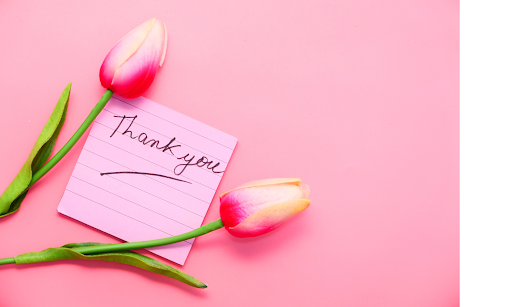 A thank you card and flowers to show appreciation to alumni for helping their K12 school