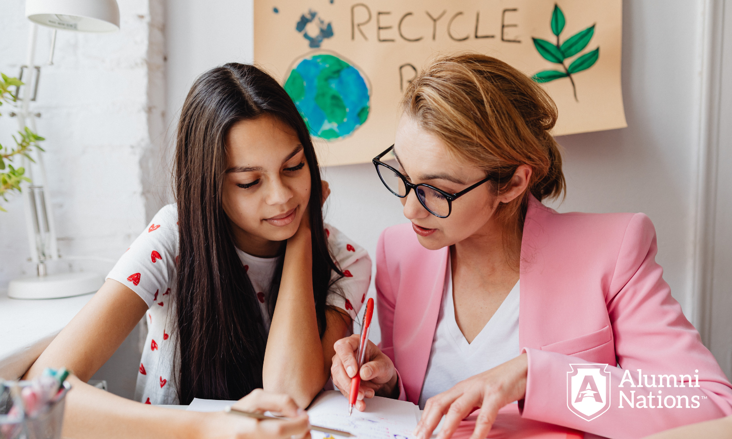 An alumni mentoring a current student of a K12 school
