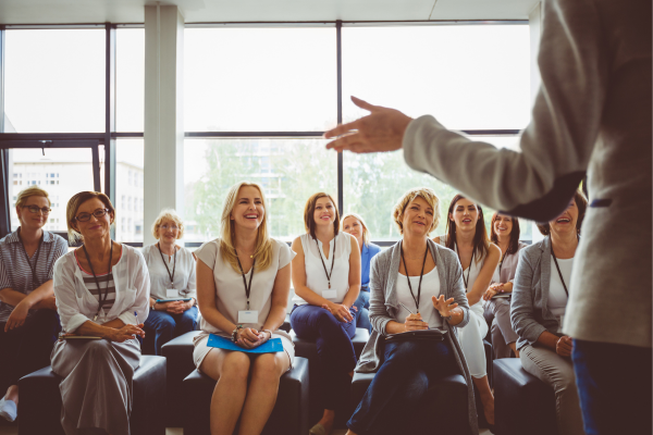 A group of people listening to a lecture.