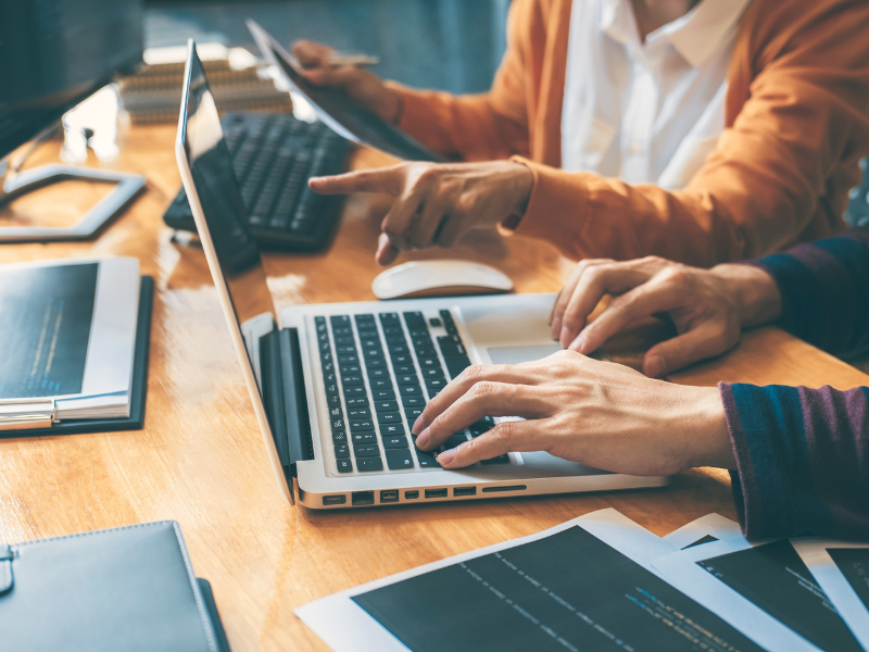 Education team reviewing mentorship program goals together.