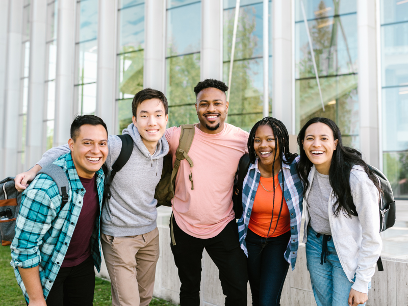 Alumni and students standing in a half circle.