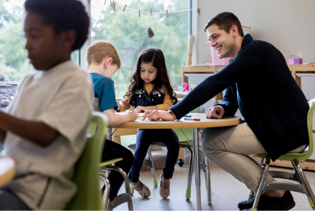 Smiling 2021 graduate holding diploma, capturing the moment students become part of their school’s alumni community.
