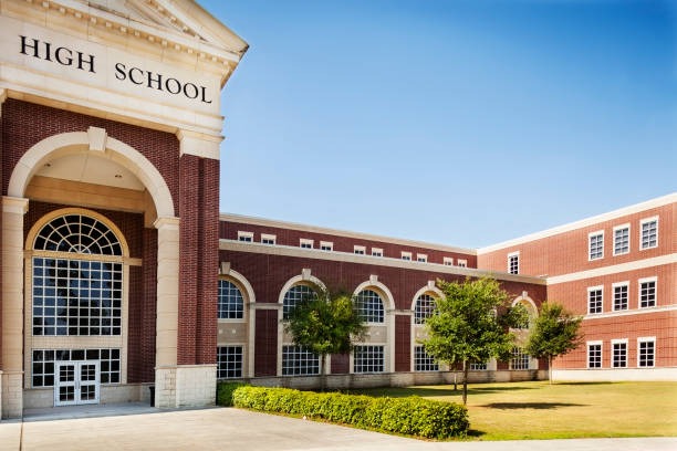 Exterior of a K12 public high school building on a clear summer day