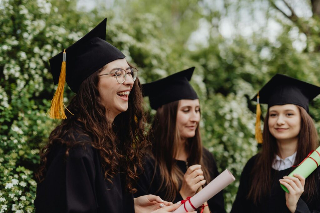 A graduating high school senior holding an award certificate.