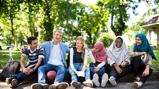 Group of students laughing together.