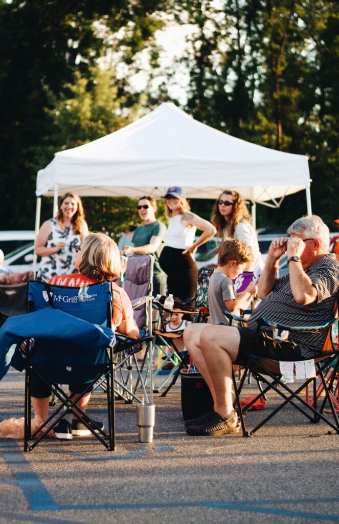  An alumni tent serving as a hub for K12 alumni engagement during a tailgate.