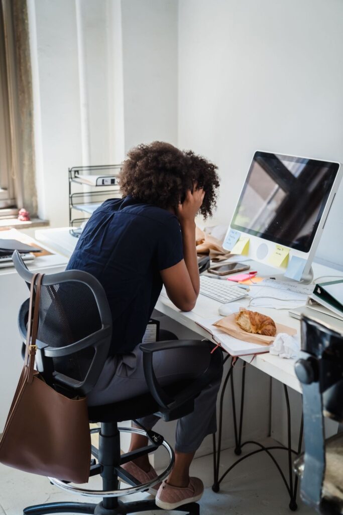 A school administrator experiencing back-to-school burnout before discovering managed alumni support.